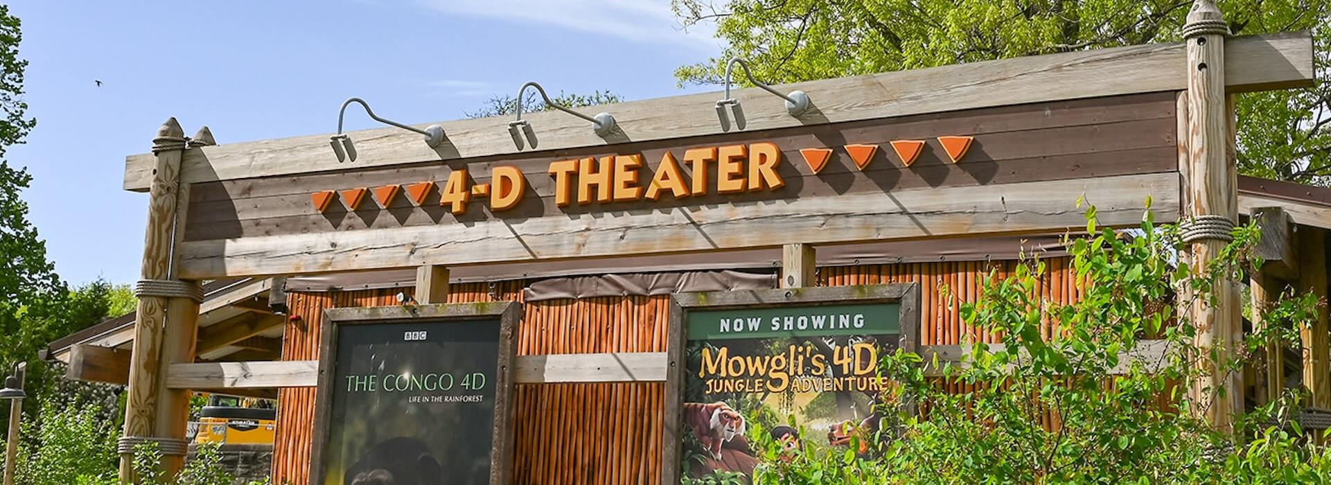 Front of theater with signs