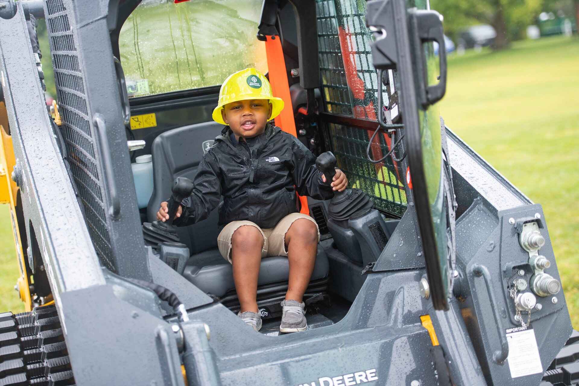 A child sitting in a tractor