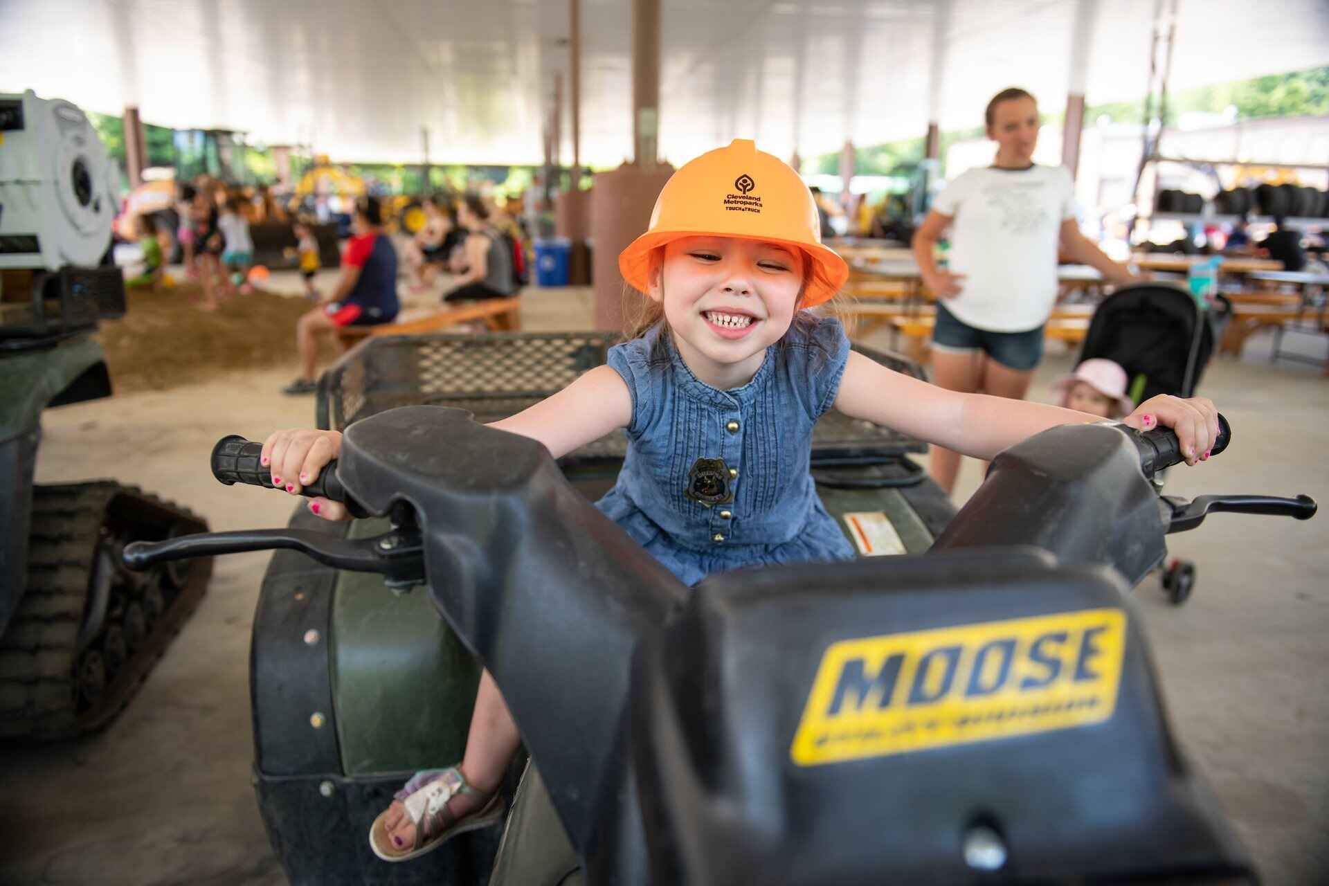 A child sitting in a tractor