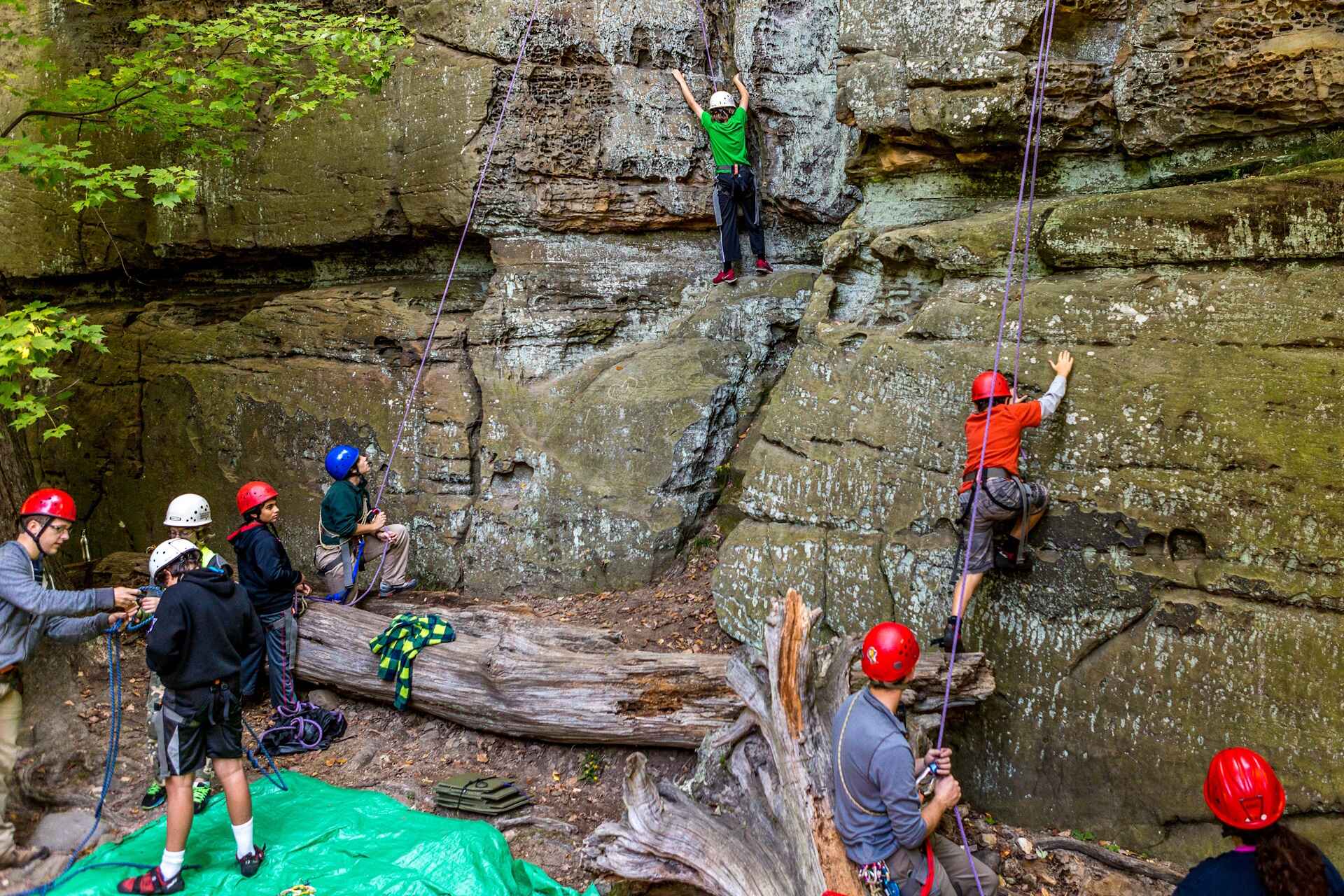 People rock climbing