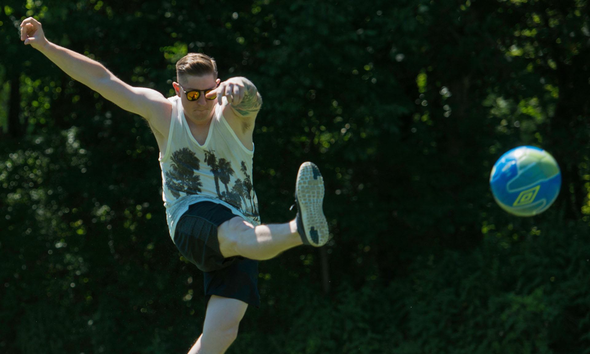 A man kicking a ball