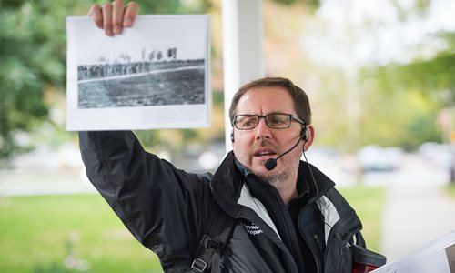 Person holding up an image printed on a piece of paper