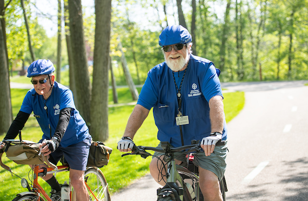 Two men riding bikes