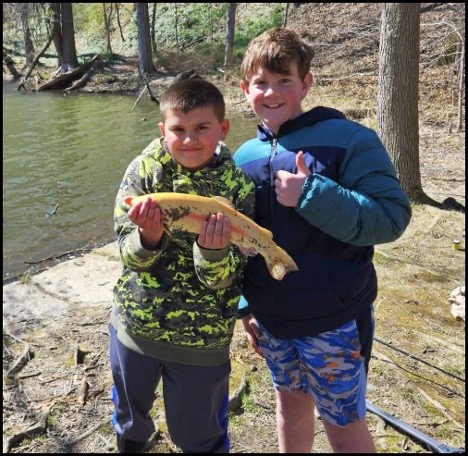 Child holding a fish