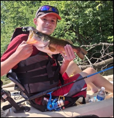 Boy holding a fish