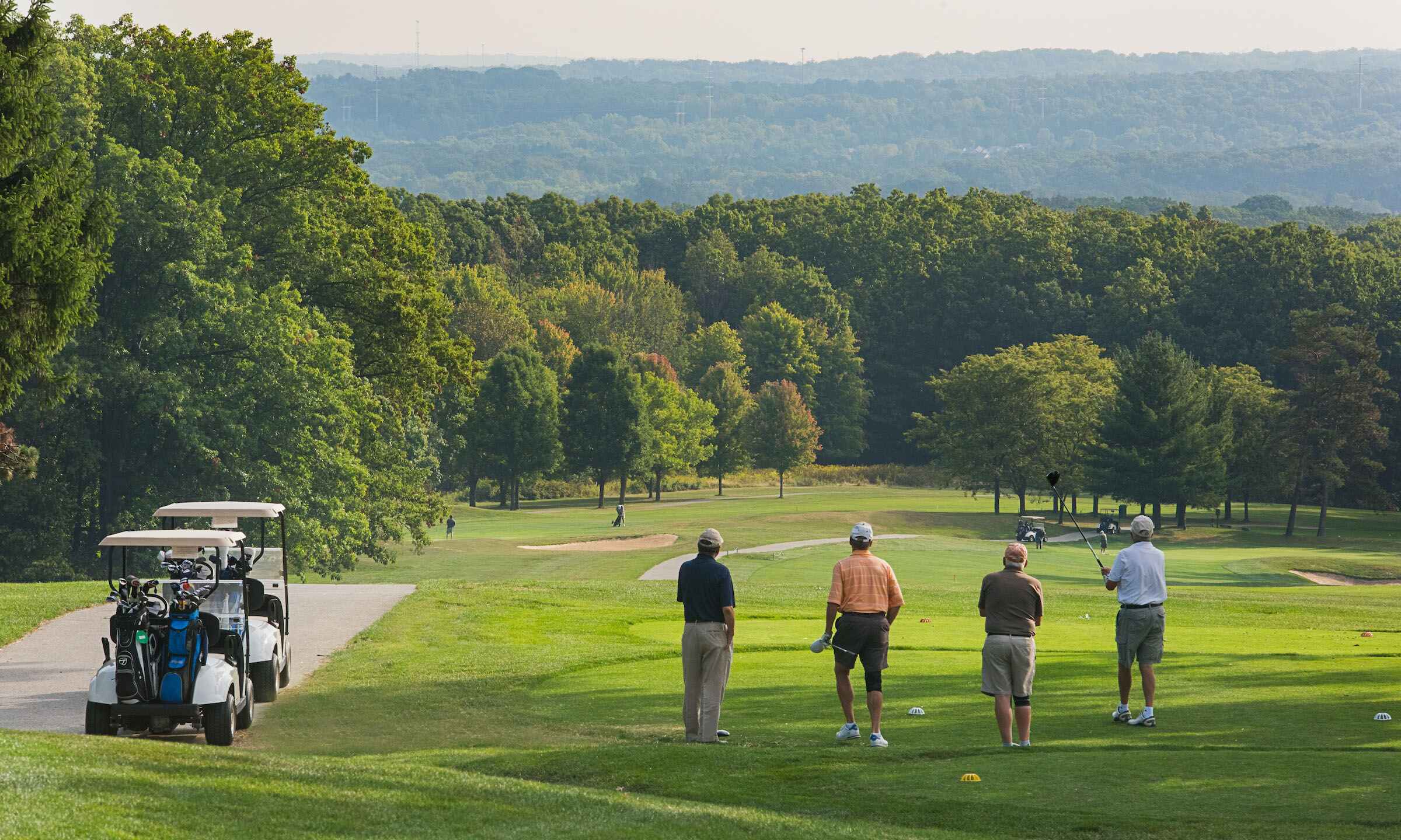 A group of people on a golf course