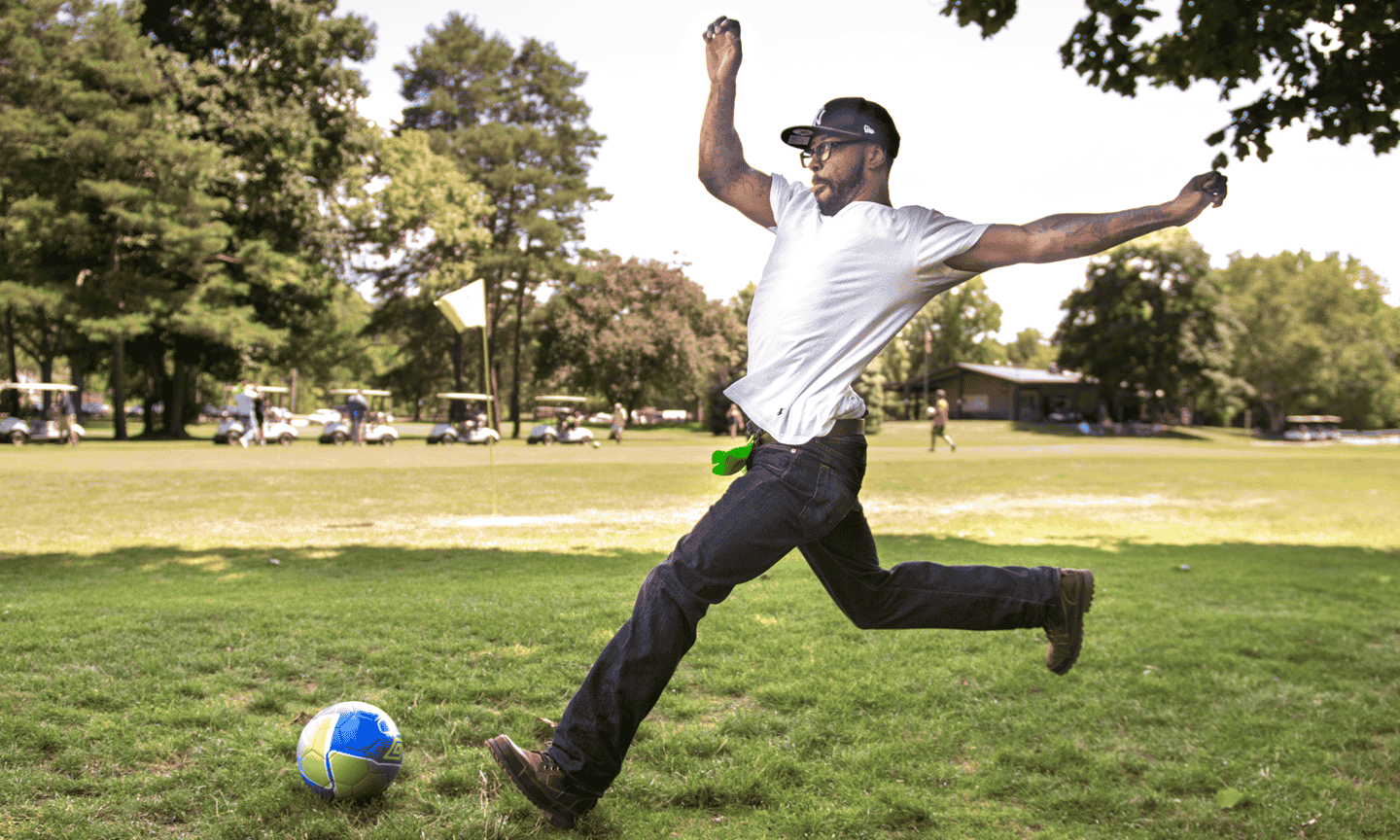 Man playing footgolf