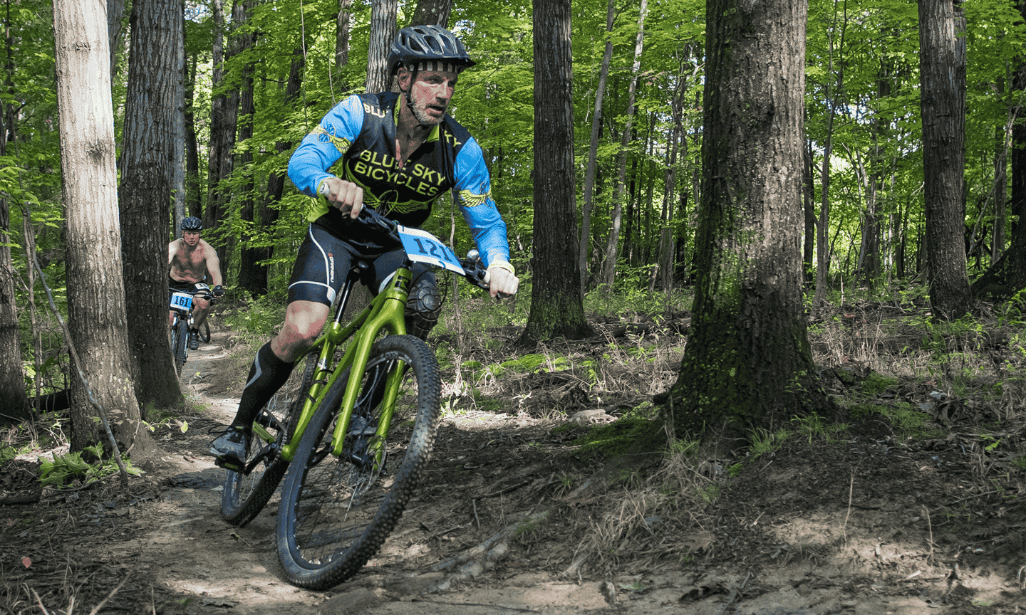 Person riding bike on mountain