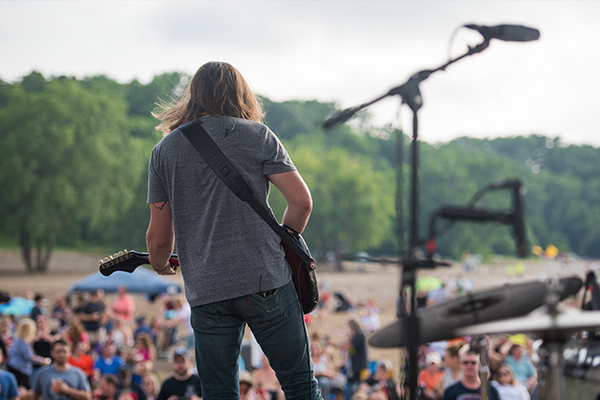 Man playing guitar on stage