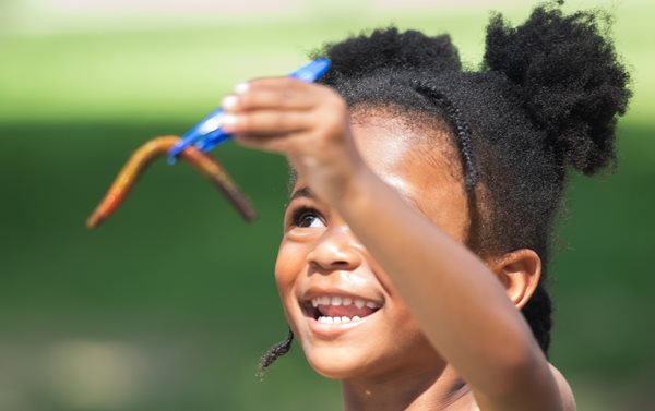 Girl holding a worm