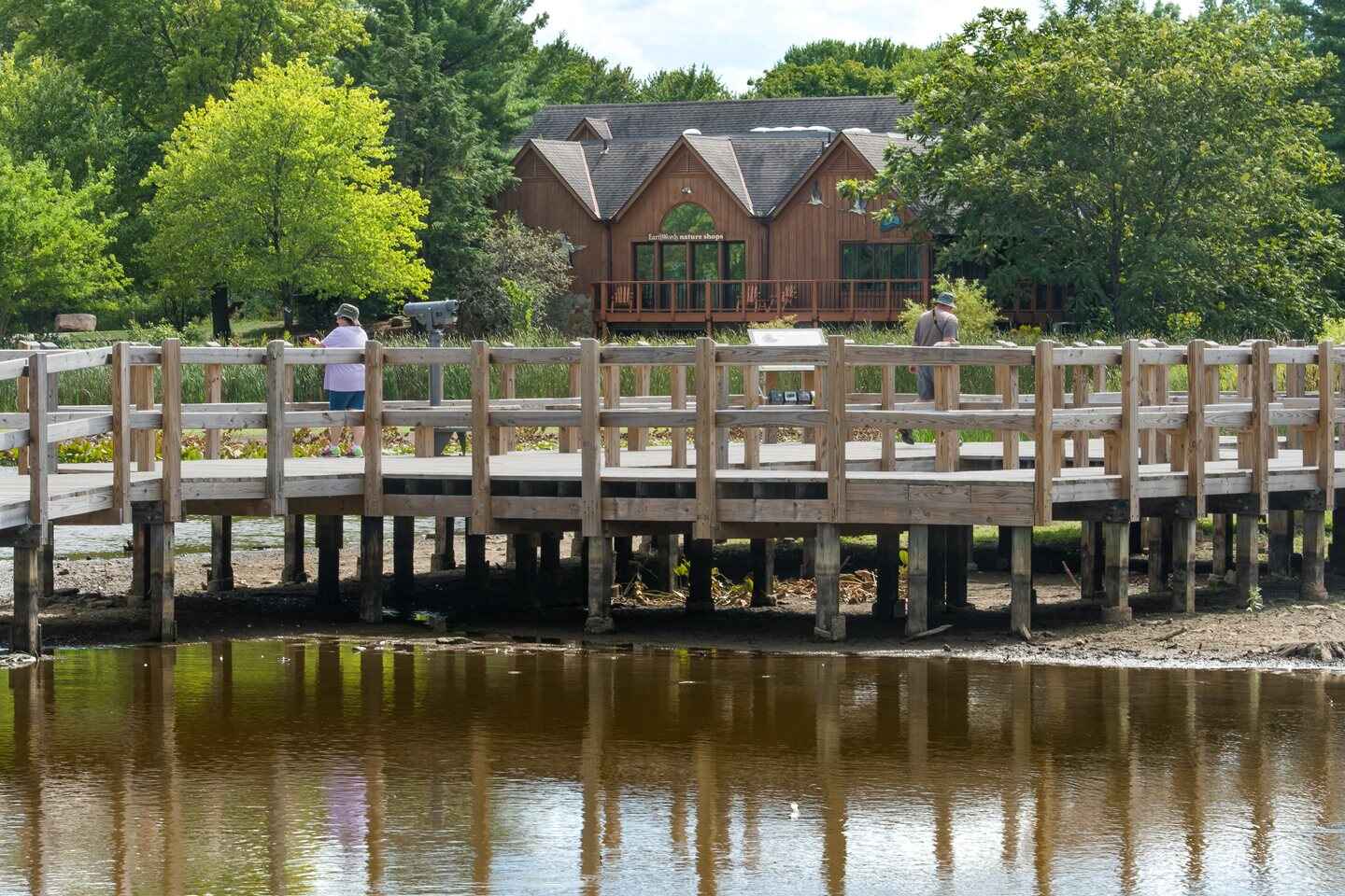 Boardwalk over water in front of the nature center building