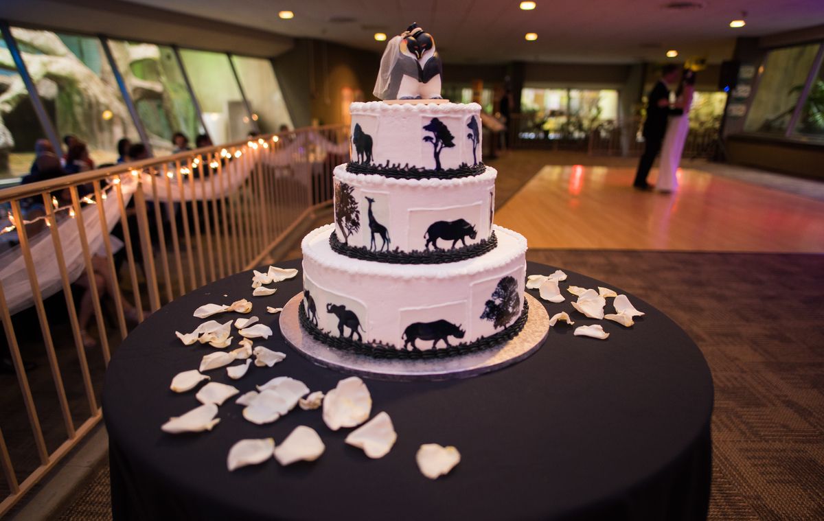 A wedding cake with animals on it