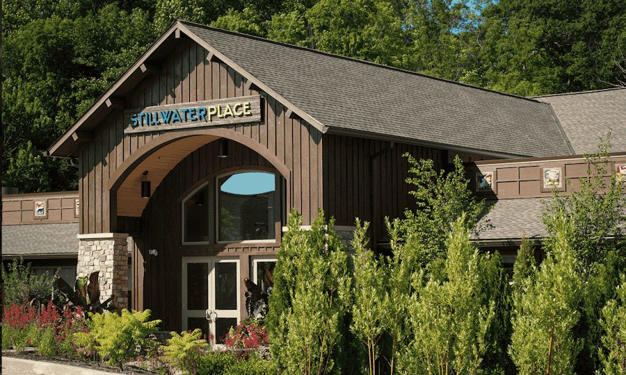 The front door of a brown building